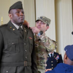 2nd Lt. Ngoufack Tsafack receives his officer bars in the commissioning ceremony