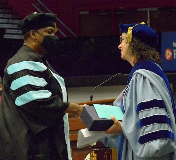 Nicole Ijames receives the award from Dr. Sydney Brown 