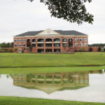 a campus shot of Tucker Student Center and the Hollifield Bell Tower