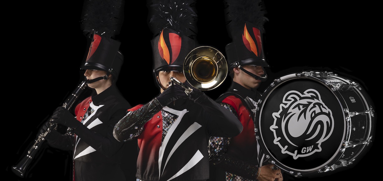 Three Marching Band Members pose in their uniforms