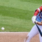 Chandler Redmond swings at a baseball during his historic game.