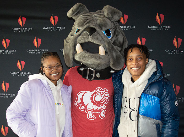 two students with mascot