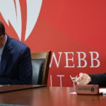 Dr. William Downs, left and Dr. Laura Leatherwood sign the agreement