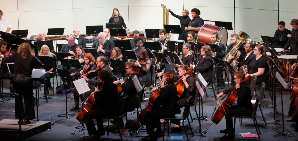 a photo of the GWU orchestra on stage