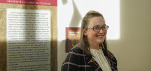A photo of Natalie Bishop standing in the gallery in Tucker
