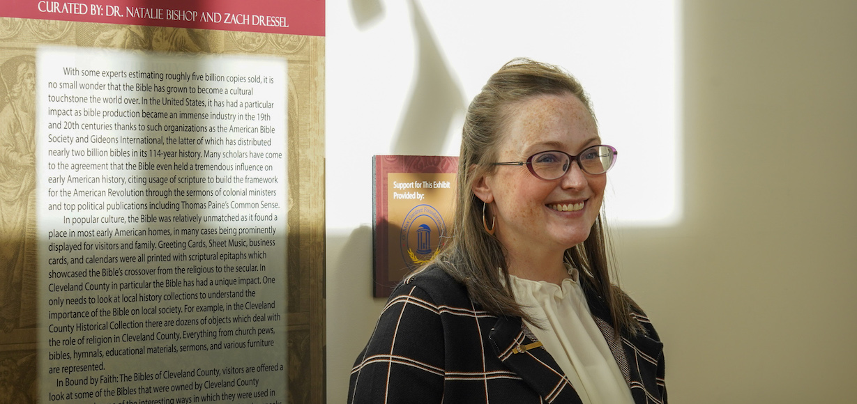 A photo of Natalie Bishop standing in the gallery in Tucker