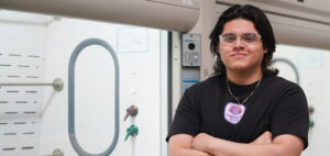 Ulises Martinez poses in the lab at GWU