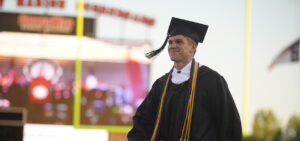 A student walks into Spangler stadium for the ceremony