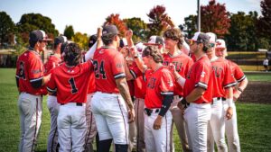 Gardner-Webb Baseball team in huddle on field