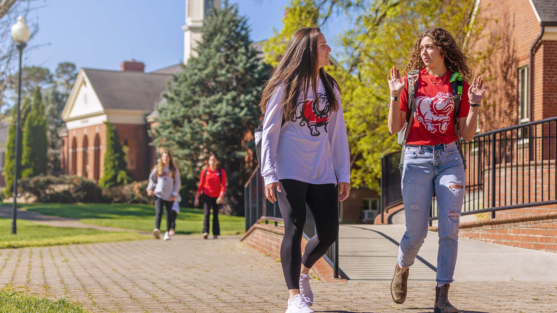 two female students walking across campus