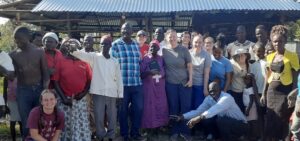 GWU team members pose with the people in Kenya.