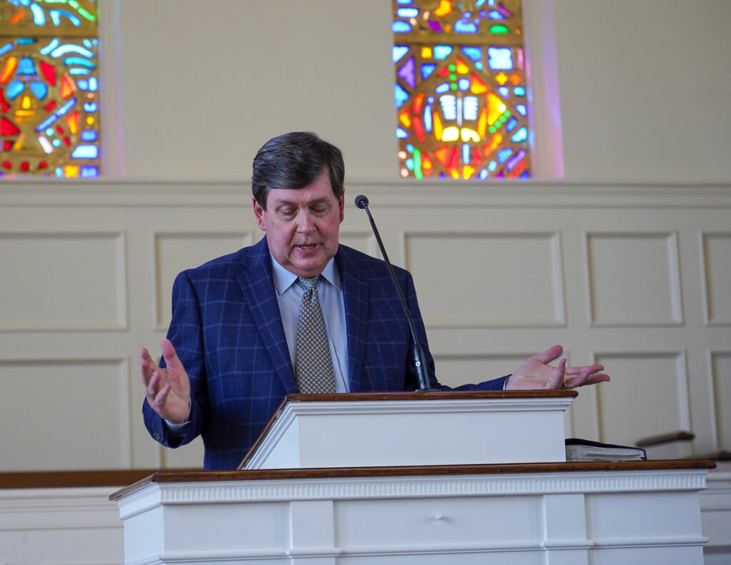 Dr. Danny West at the podium in Dover Chapel