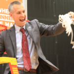 Tim Craft cuts the net at the championship game in 2019.
