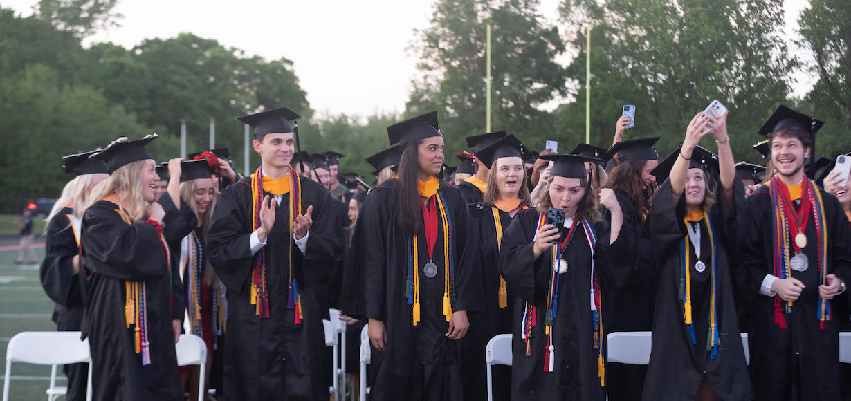 graduates celebrate after the ceremony