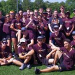 A group photo of Carolina Crown Members and Sarah Fabian