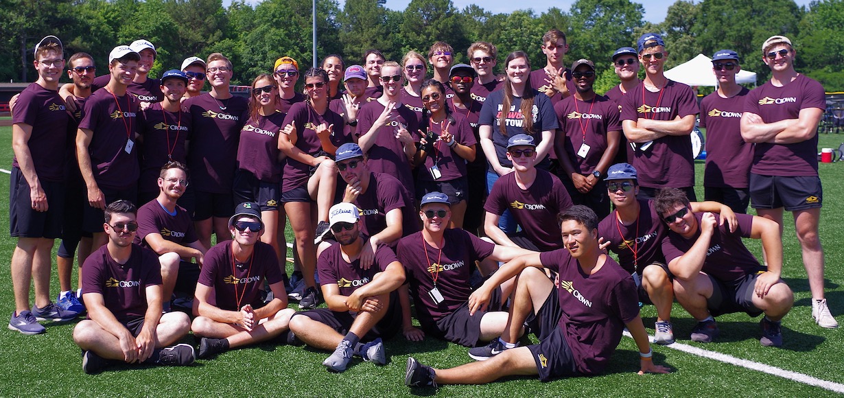 A group photo of Carolina Crown Members and Sarah Fabian