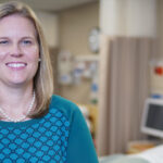 Tracy Arnold stands in a simulation lab