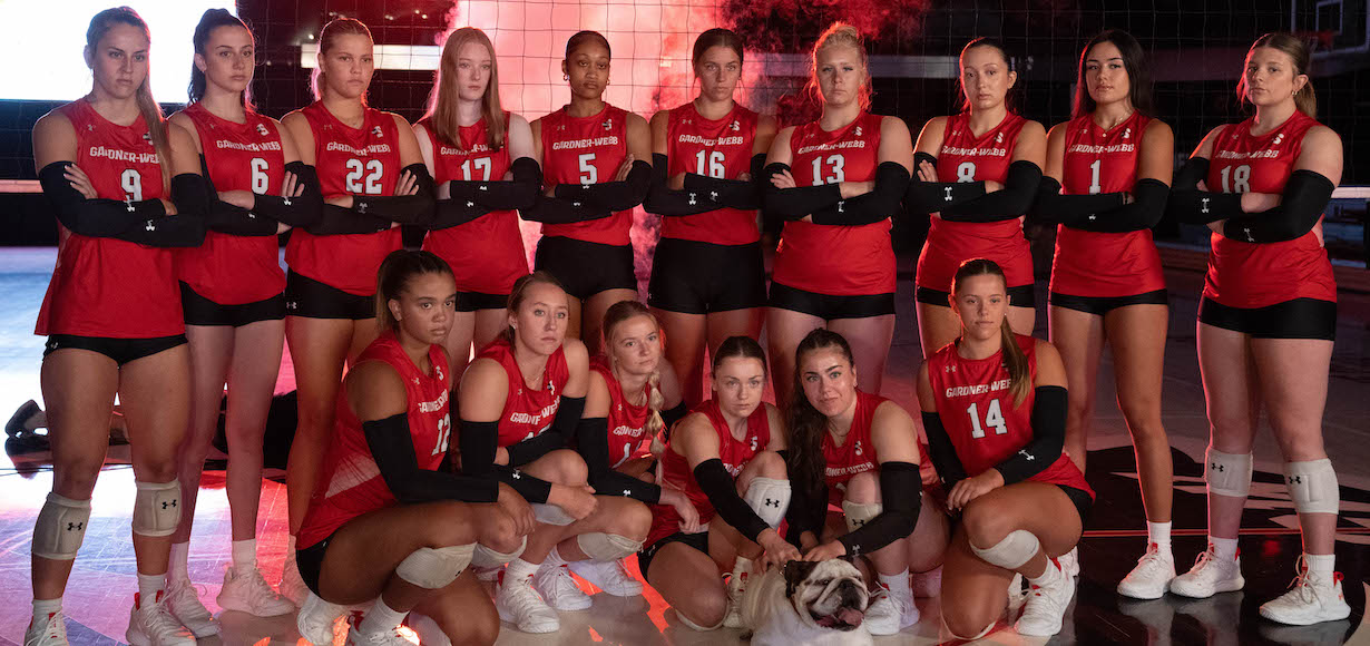 The GWU volleyball team poses for a photo in Paul Porter Arena