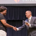 Dr. Lorell Gordon Accepts an award