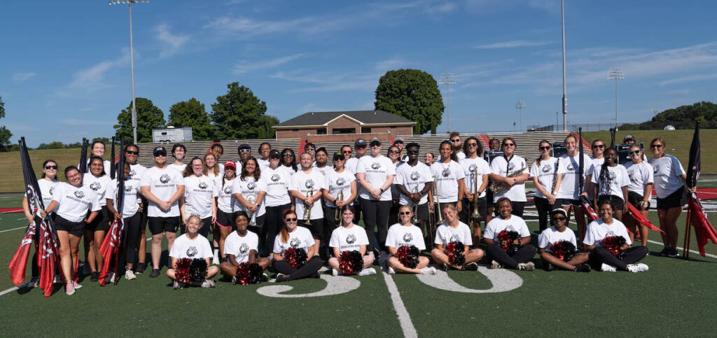 a group shot of the Marching Bulldogs on the football field