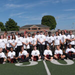 a group shot of the Marching Bulldogs on the football field