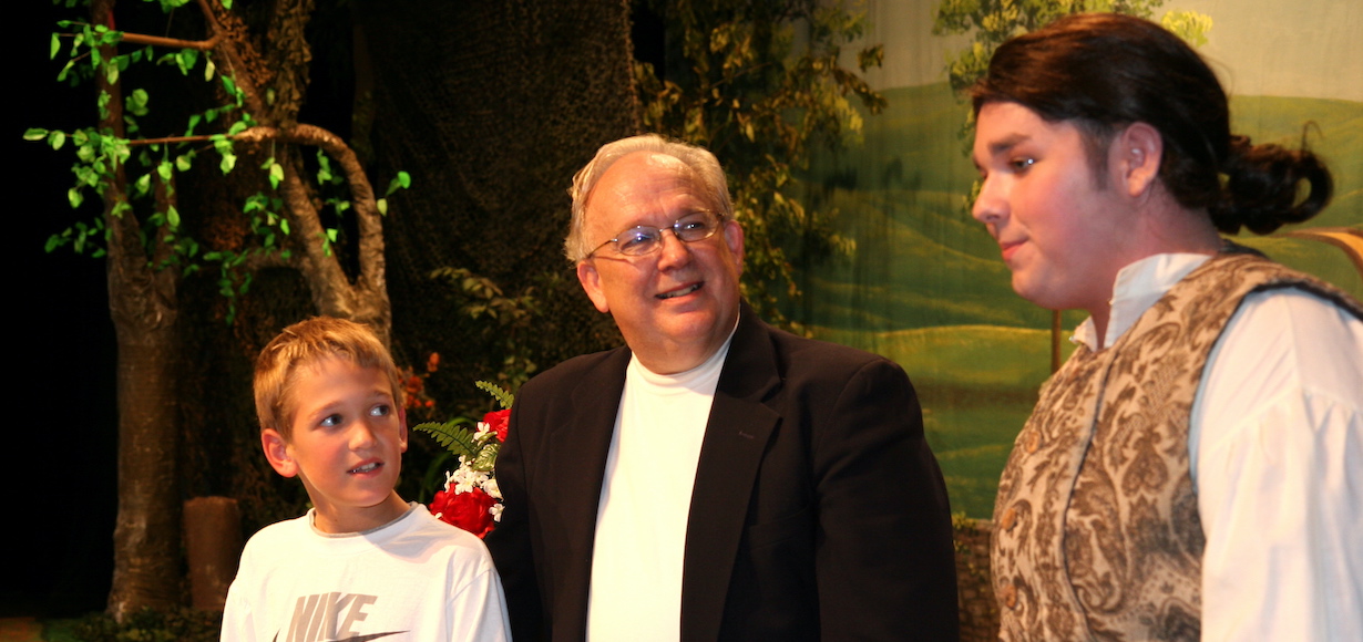 Dr. Terry Fern with an actor and a student on the opera stage