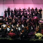 The chorus and orchestra on the stage of Dover Theatre for Festival of Lights