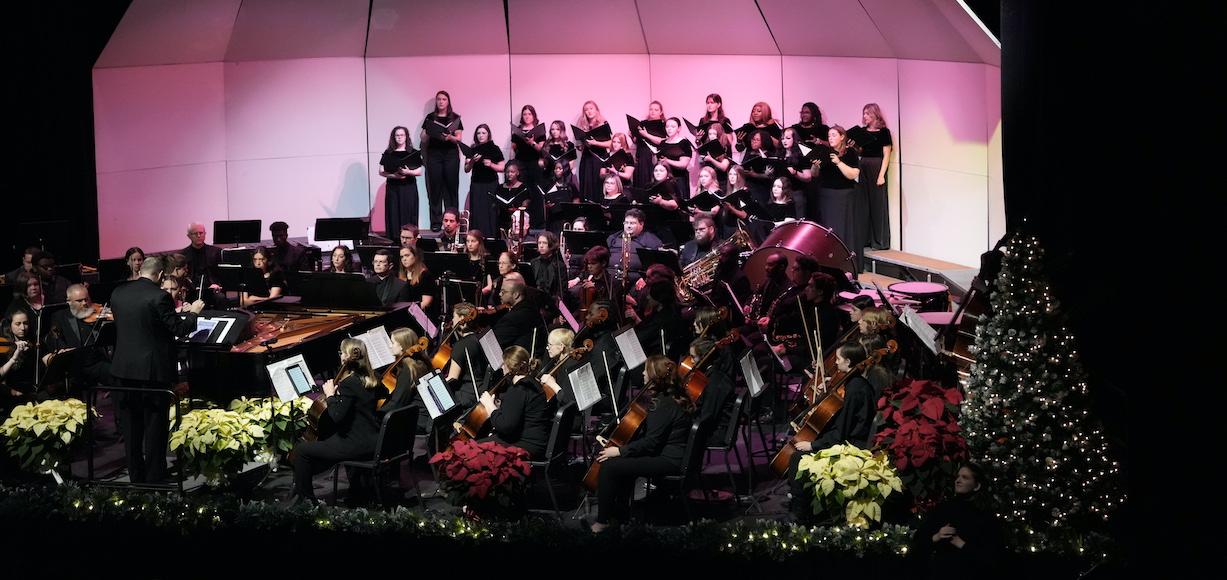 The chorus and orchestra on the stage of Dover Theatre for Festival of Lights