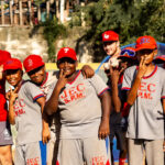 members of the baseball team with children in Dominican Republic
