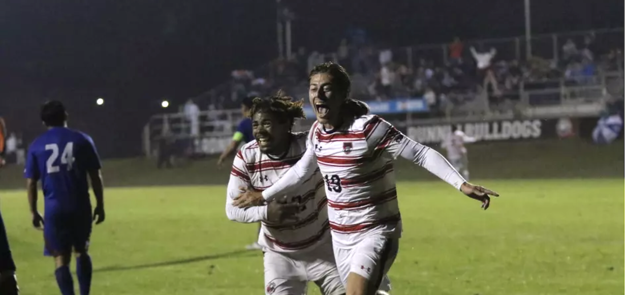 men's soccer players celebrate after a win