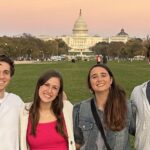 four young adults posing on the Mall in Washington, D.C.