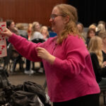 A bingo player shows her winning game card