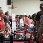 a student asks a question of the admission team