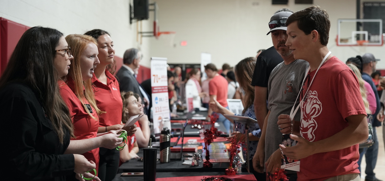 a student asks a question of the admission team