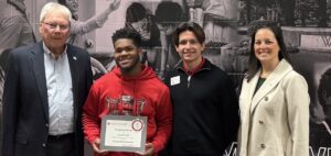 The winner of the Godbold scholarship poses with John Godbold and Godbold Dean Mischia Taylor and an Admissions Counselor.