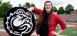 Sarah Fabian posing with bass drum