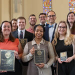 Students holding their awards