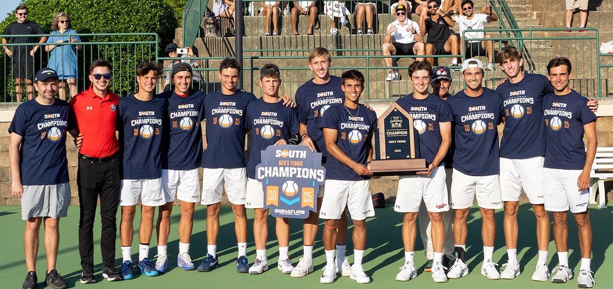 The men's tennis team poses after winning the Big South Conference.
