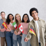 college students standing and holding flags