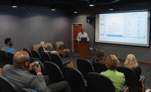 A student presents his grant proposal to the class