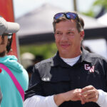 Will Corn talking to staff on campus