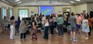 A group of teachers participate in a music literacy workshop