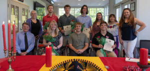 Students and professors pose at the Sigma Delta Pi induction ceremony