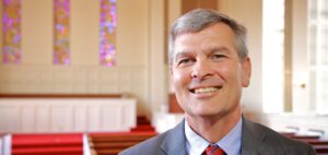 Dean Dr. Robert Canoy poses in Dover Chapel
