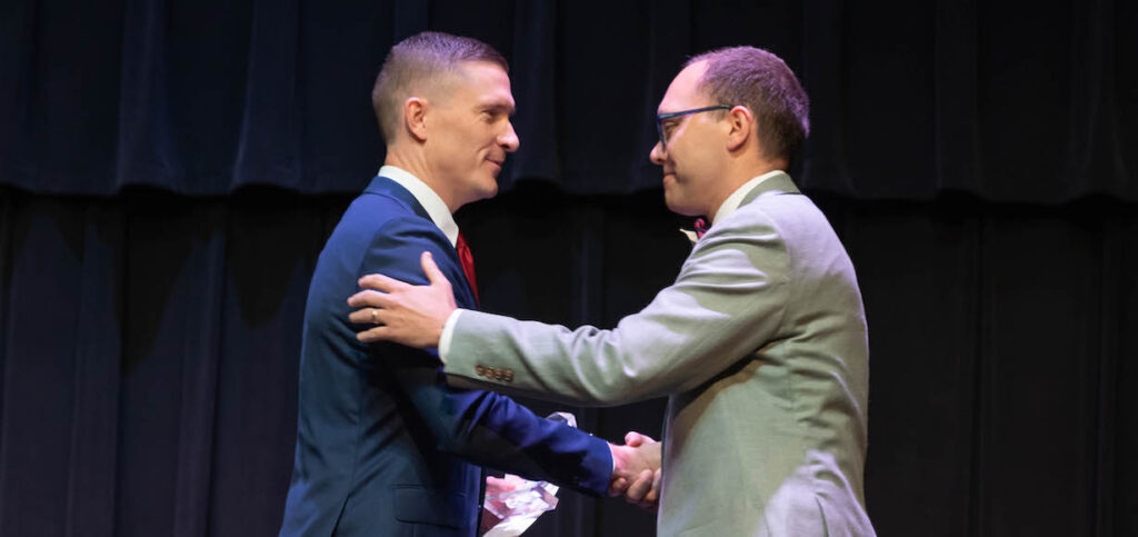 Nate Evans Shakes Hands with Aaron Rice