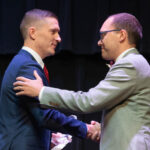 Nate Evans Shakes Hands with Aaron Rice