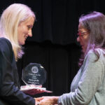 Interim Provost and Vice President of Academic Affairs Dr. Nicole Waters congratulates Professor of Religious Studies Dr. Paula Qualls on receiving the Excellence in Teaching Award.