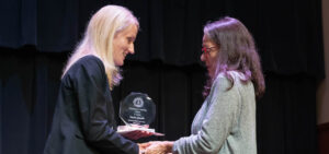 Interim Provost and Vice President of Academic Affairs Dr. Nicole Waters congratulates Professor of Religious Studies Dr. Paula Qualls on receiving the Excellence in Teaching Award.