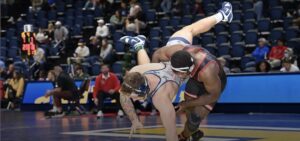 two wrestlers compete in a match