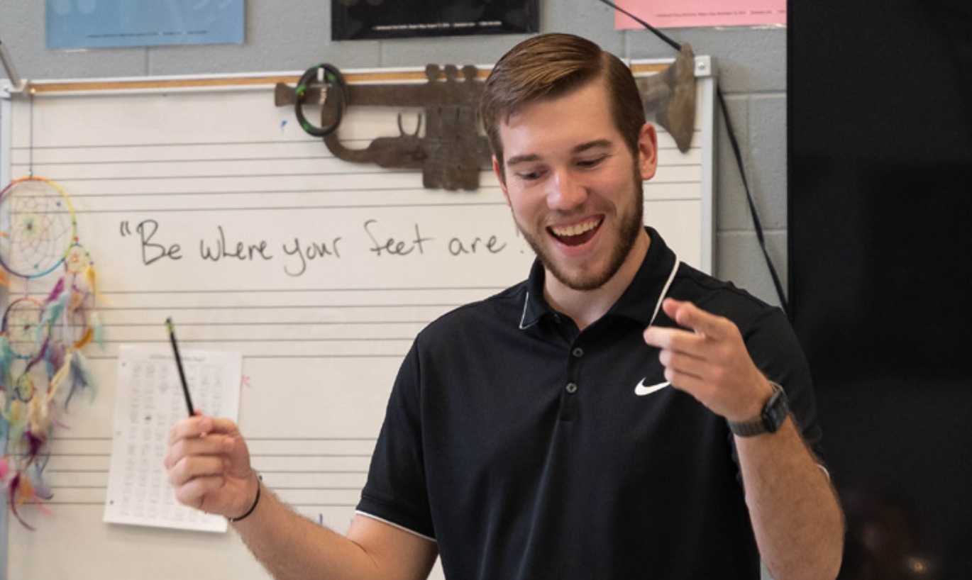 Connor Settlemyre in front of class